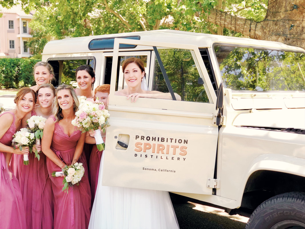 Bridesmaids posing with Prohibition Spirits Truck